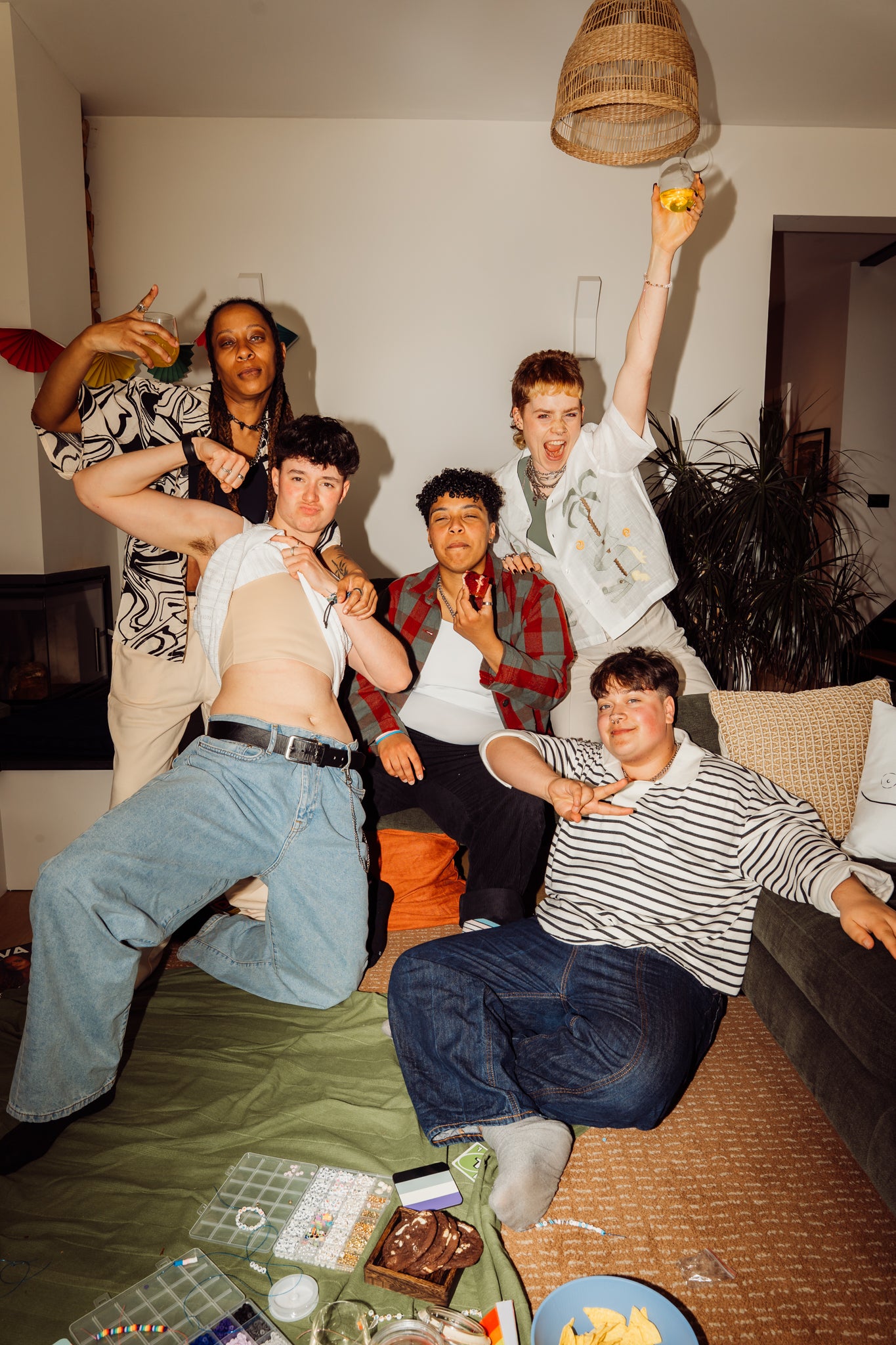 A group of transgender and non binary friends in a living room.