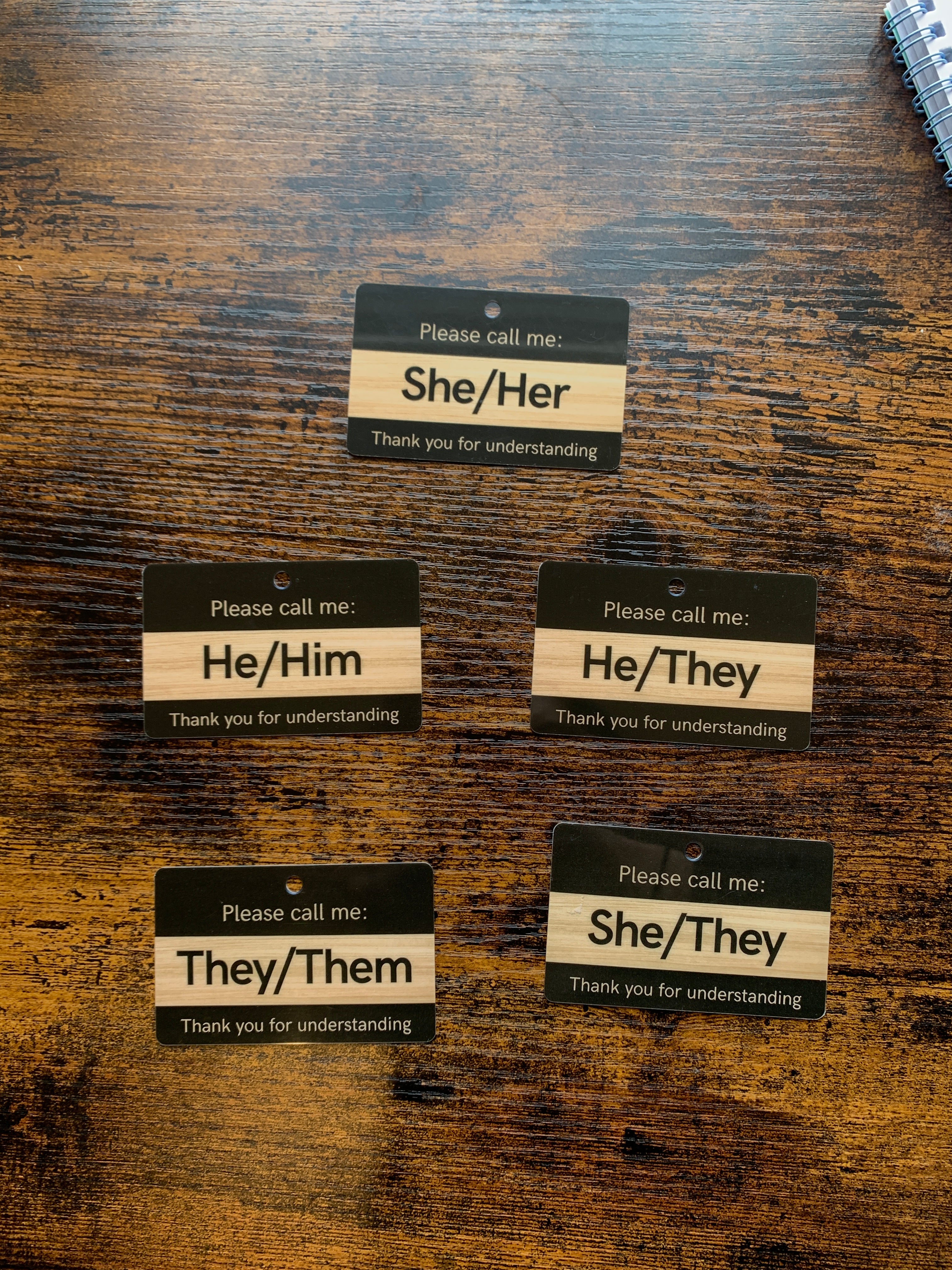 Set of pronoun cards on a wooden surface